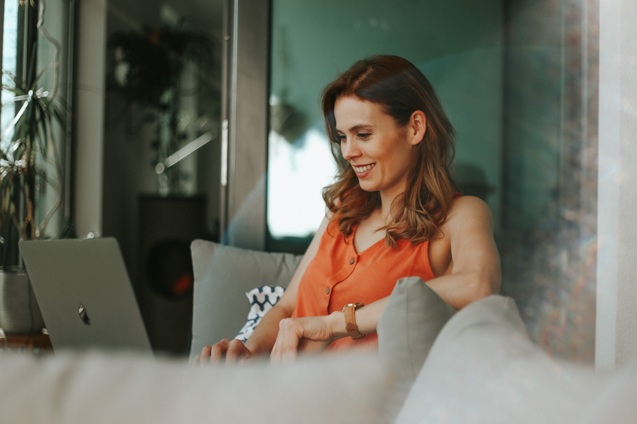 woman researching buy to let mortgage on laptop