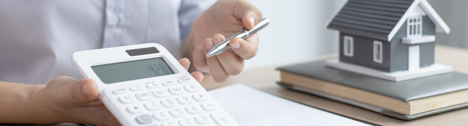 A man holding a calculator